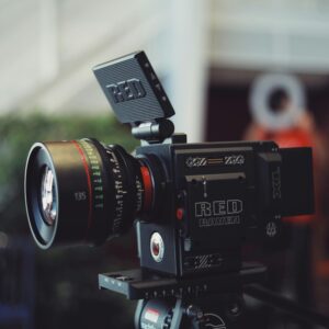 Close-up of a RED Raven video camera on a tripod, perfect for filmmaking and video production.